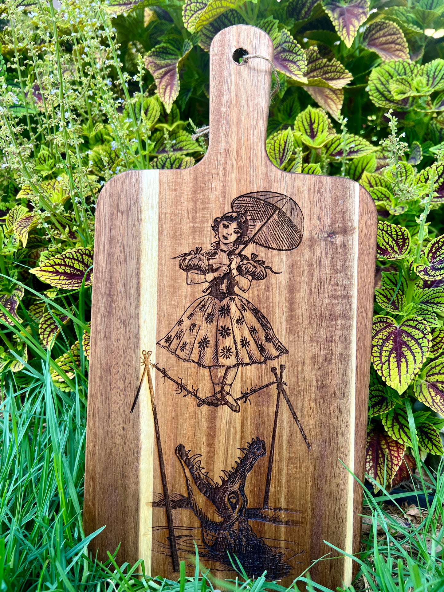 Charcuterie & Cutting Board - The Doomed Tightrope Walker from the stretching room!  Sally Slater 16” X 8” engraved on Acaci