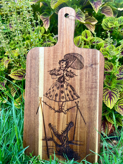 Charcuterie & Cutting Board - The Doomed Tightrope Walker from the stretching room!  Sally Slater 16” X 8” engraved on Acaci